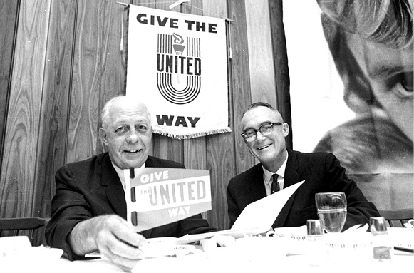 Two males with United Way sign